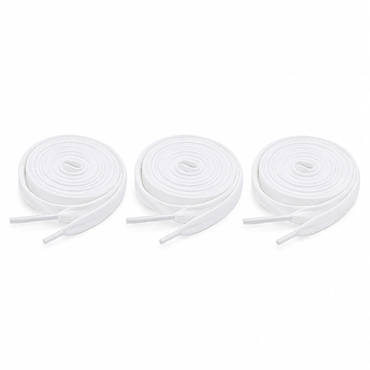 Three coiled pairs of flat white cotton laces